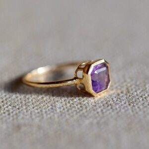Elegant Gold and Purple Gemstone Ring